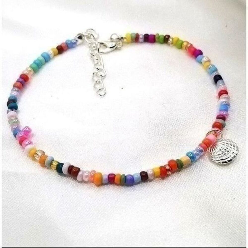 Rainbow multi colored beaded Adustible dantiy sea shell bracelet.